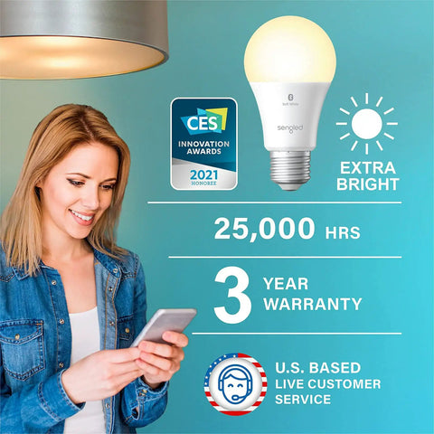 Woman using phone next to Alexa Compatible Smart Light Bulbs 100W Equivalent, 1500 Lumens, Soft White 2700K, with features highlighted.