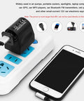 2 Pack AC To DC Converter 220V To 12V 500MA Car Cigarette Lighter Socket Adapter plugged into a power strip with phone charging.