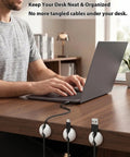 6 Pack White Cable Clips For Desk Nightstand And Car, Easy Cord Management Holders securing cables on a desk with laptop