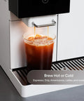 Next Level Super Automatic Espresso Machine Delivering One Hundred Thousand Custom Drink Combos And Creamy Milk Froth For That Straight Fire Daily Grind Routine In Classic Black pouring iced coffee into a clear cup.