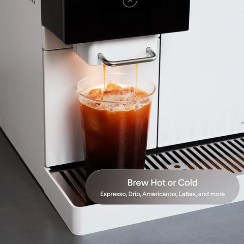 Next Level Super Automatic Espresso Machine Delivering One Hundred Thousand Custom Drink Combos And Creamy Milk Froth For That Straight Fire Daily Grind Routine In Classic Black pouring iced coffee into a clear cup.