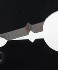 Close-up of a die plate from Precision Crimping Tool Size L With Interchangeable Die Set PAD-13 showing edge detail.