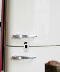 Kid Proof Cabinet And Fridge Locks With Double Button Design on a white fridge door, durable brown ABS, easy installation