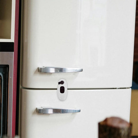 Kid Proof Cabinet And Fridge Locks With Double Button Design on a white fridge door, durable brown ABS, easy installation