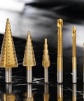 Six Piece High Speed Reaming Pagoda Sawtooth Drill Bit Set With Titanium Plating In Box For Metal And Wood on black surface