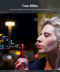 Woman blowing bubbles with a red liquid, showcasing true 60fps clarity, demonstrating dynamic movement.