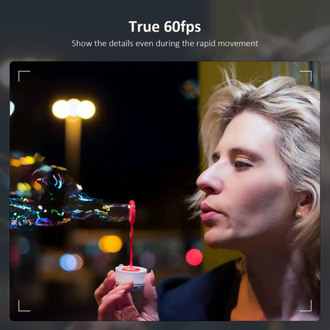 Woman blowing bubbles with a red liquid, showcasing true 60fps clarity, demonstrating dynamic movement.