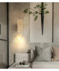 Natural Limestone LED Sconce Wall Lamp illuminating modern living room decor, enhancing ambiance near cozy sofa.