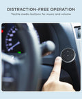Bluetooth Media Button With Steering Wheel Mount For Cars And Bikes installed on car dashboard, finger pointing to button.