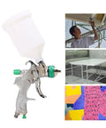 Professional Grade Hvlp Paint Sprayer Kit With Six Hundred Mil Gravity Tank And Three Nozzle Heads displayed with user painting surfaces.