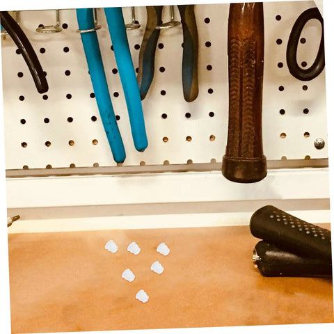 100 Pcs Plastic Hole Plugs White Screw Cap Covers For Cabinets Shelves And Furniture Quick Fix Dust Protection And Reno Boost For Home Office Decor Now on a workbench with tools in background