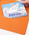 Hand holding illustration against bright orange 1.5 Inch 3 Ring Binder With Clear View Cover Holds 300 Sheets Of US Letter Paper Multipocket Design.