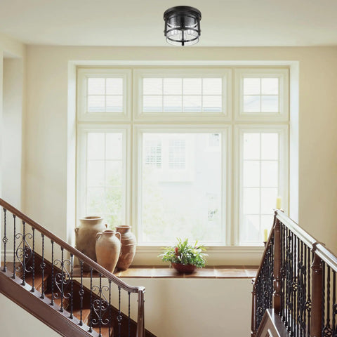 Three Light Rustic Modern Flush Mount Ceiling Light in dark bronze with brass details, clear glass shade in stairway.