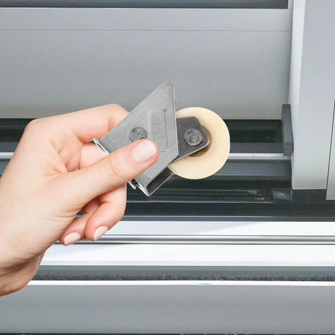 Top Shelf Stainless Steel Sliding Door Roller Featuring Adjustable Window Track Wheel shown in hand for easy installation.