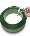 Heavy Duty Green Polyester Strapping Roll For Solid Pallet Securing 5/8 Inch Wide By 4000 Feet Long being measured with calipers.
