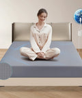 Grounding Sheets With Silver Fiber Conductive Bed Sheet Kit, Deep Pocket Full XL Gray, depicted on a bed with person meditating.