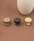 Three cabinet knobs in brushed gold, black, and gold knurled finish, part of 10 Pack Brushed Gold Cabinet Knobs With Gold Knurled Drawer Pulls