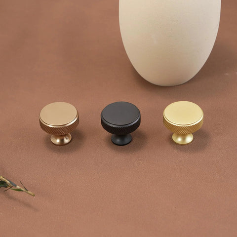 Three cabinet knobs in brushed gold, black, and gold knurled finish, part of 10 Pack Brushed Gold Cabinet Knobs With Gold Knurled Drawer Pulls