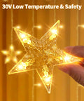 Close-up of Dazzle Bright Ramadan Curtain String Lights With 138 LEDs Warm White Star Moon Fairy Lights held in hand