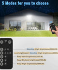 Remote adjusting modes of Motion Sensor Outdoor Security Lights With Remote, 2500 Lumens Ultra Bright LED, shown on house at night.