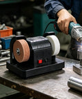 Workhorse Dual Wheel Electric Knife Sharpener And Polisher With Double Grinding Plates For Quick Kitchen Tool Upkeep Rust Removal And Precision Blade Honing In Your Home Shop Setup on a workshop table.