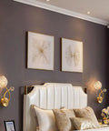 Modern Copper And Clear Crystal Glass Wall Sconces Featuring Slick Up And Down Lighting For Bathroom Vanity And Living Room Decor With Heavy Duty Build And Chill Ambient Vibes Two Pack above a stylish headboard in a bedroom.