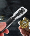 Must Have Dual Function Watch Case Opener And Spring Pin Tool Set showing tool and watch mechanism