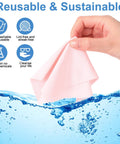 Hand holding a pink gentle microfiber cleaning cloth above water with icons showing benefits for glasses and electronics pack of 50 pcs.