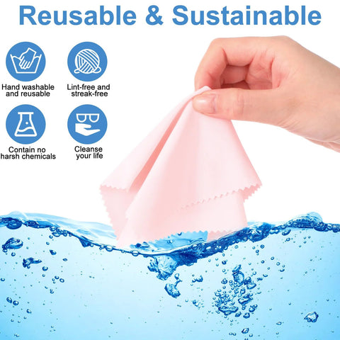 Hand holding a pink gentle microfiber cleaning cloth above water with icons showing benefits for glasses and electronics pack of 50 pcs.