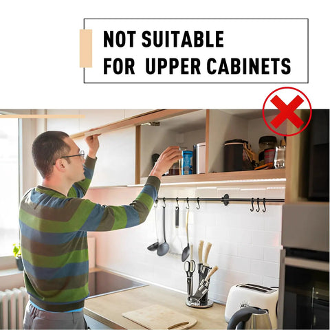 Person opening kitchen cabinet with note 'Not Suitable for Upper Cabinets' displayed.