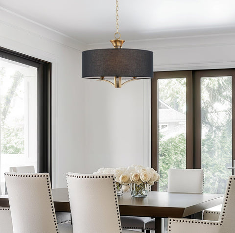 Alondra 20 Inch Modern Drum Gold Chandelier With Large Black Linen Shade 3 Light Modern Farmhouse Hanging Pendant Ceiling Light In Warm Brass Finish For Living Room Kitchen Island in a dining setting.