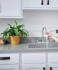 Parkwood Two Handle Kitchen Faucet Deck Mount in Stainless with Aerated and Spray Options, ADA Compliant, in modern kitchen setup