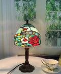 Rose Flower Tiffany Style Stained Glass Table Lamp With 8 Inch Wide Lampshade And 15 Inch Tall Red Finish, on table with teacup