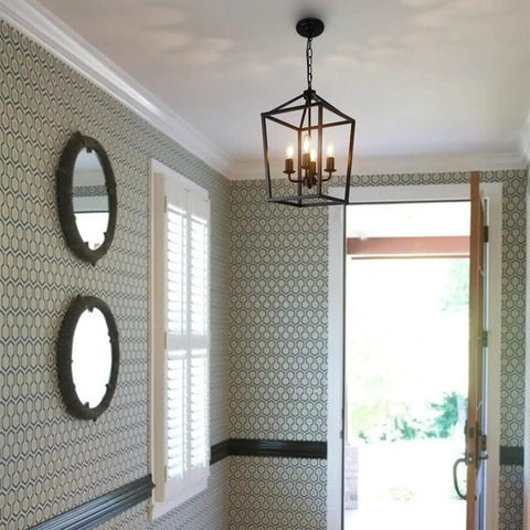 4 Light Black Farmhouse Chandelier With Open Iron Lantern Frame in a hallway, mirrors on patterned wallpaper, ceiling view
