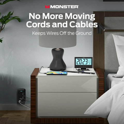 Nightstand setup with lamp, clock, and smartphone, showing Beefy 6 Outlet Surge Protector Wall Tap With USB A And USB C Ports, 1,200 Joules.