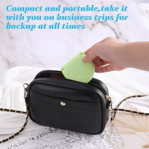 Hand placing green case of 20 Pack Mini Travel Sewing Kit Set For On The Go Repairs with Scissors Needles in black purse