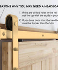 Close-up of a light gold brushed brass sliding barn door hardware kit installed on a wooden door with visible headboard instructions