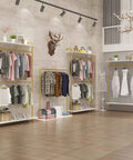 Hella Sturdy Two Tier Industrial Garment Rack With Thick Wood Shelf And Durable Metal Frame Wall Mounted double rods showcasing clothes in a boutique.