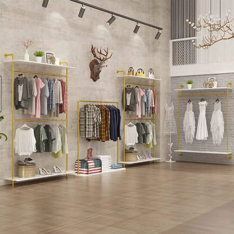 Hella Sturdy Two Tier Industrial Garment Rack With Thick Wood Shelf And Durable Metal Frame Wall Mounted double rods showcasing clothes in a boutique.