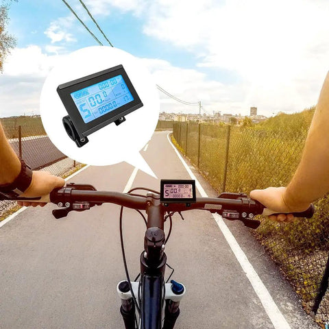 Cyclist using KT LCD3 Electric Bike Display Meter With Waterproof Plug For KT Controller 36V 48V 72V Conversion Kit on a road
