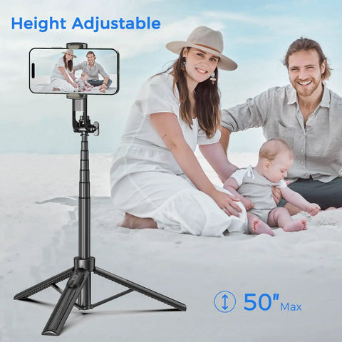Family using the Go To 50 Inch Extendable Selfie Stick Tripod For Phones With Remote Shutter on a beach.
