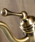 Detail of Victorian Mono Block Bathroom Faucet In Antique Brass With Drip Free Cartridge and 6 Inch Spout Reach