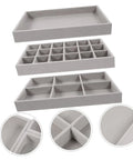 Three Piece Multi Grid Jewelry Organizer Trays Featuring Earring Stands Necklace Display Plates And Soft Velvet Ring Inserts To Make Sorting Your Bling A Breeze For Home Or Showroom Use. Grey trays stacked with soft velvet inner layers.