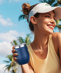 12oz Double Wall Vacuum Insulated Stemless Wine Tumbler With Straw And Lid Stainless Steel Cup held by woman in sunny outdoor setting.