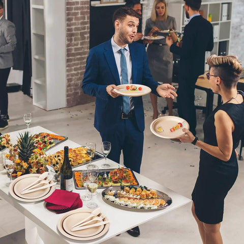 Eco Friendly Sugarcane Disposable Dinnerware Set with 250 pieces of compostable plates and utensils at a party setting