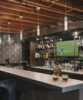 Pendant Lights For Kitchen Island 2 Pack Dope Modern Crystal Cylindrical Hanging Bar Lights illuminating a stylish bar area.