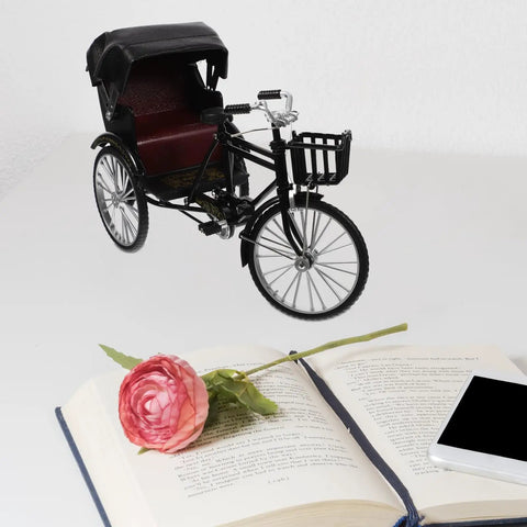 Absolutely Sweet Mini Motorcycle And Vintage Rickshaw Cake Topper With Detailed Metal Alloy Body, displayed next to a book and flower.