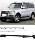 Heavy Duty Tailgate Support Strut For Mitsubishi Pajero Replaces OEM 5822A001 installed on silver SUV with robust design.