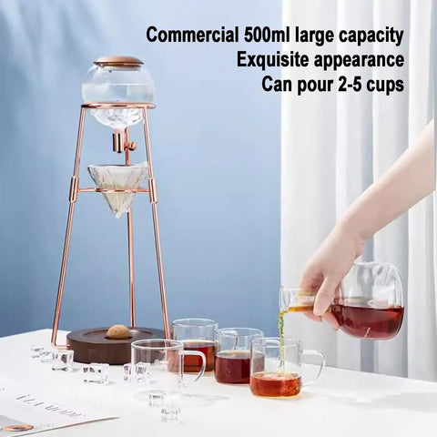Polished Glass Cold Brew Coffee Maker Featuring Precise Drip Valve And Rugged Stainless Steel Base serving iced tea on a table with cups.