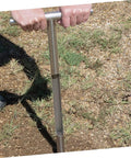 Hands using Stainless Steel Soil Sampler Probe With T Handle Contractor Grade Lightweight And Durable Tool on grassy ground